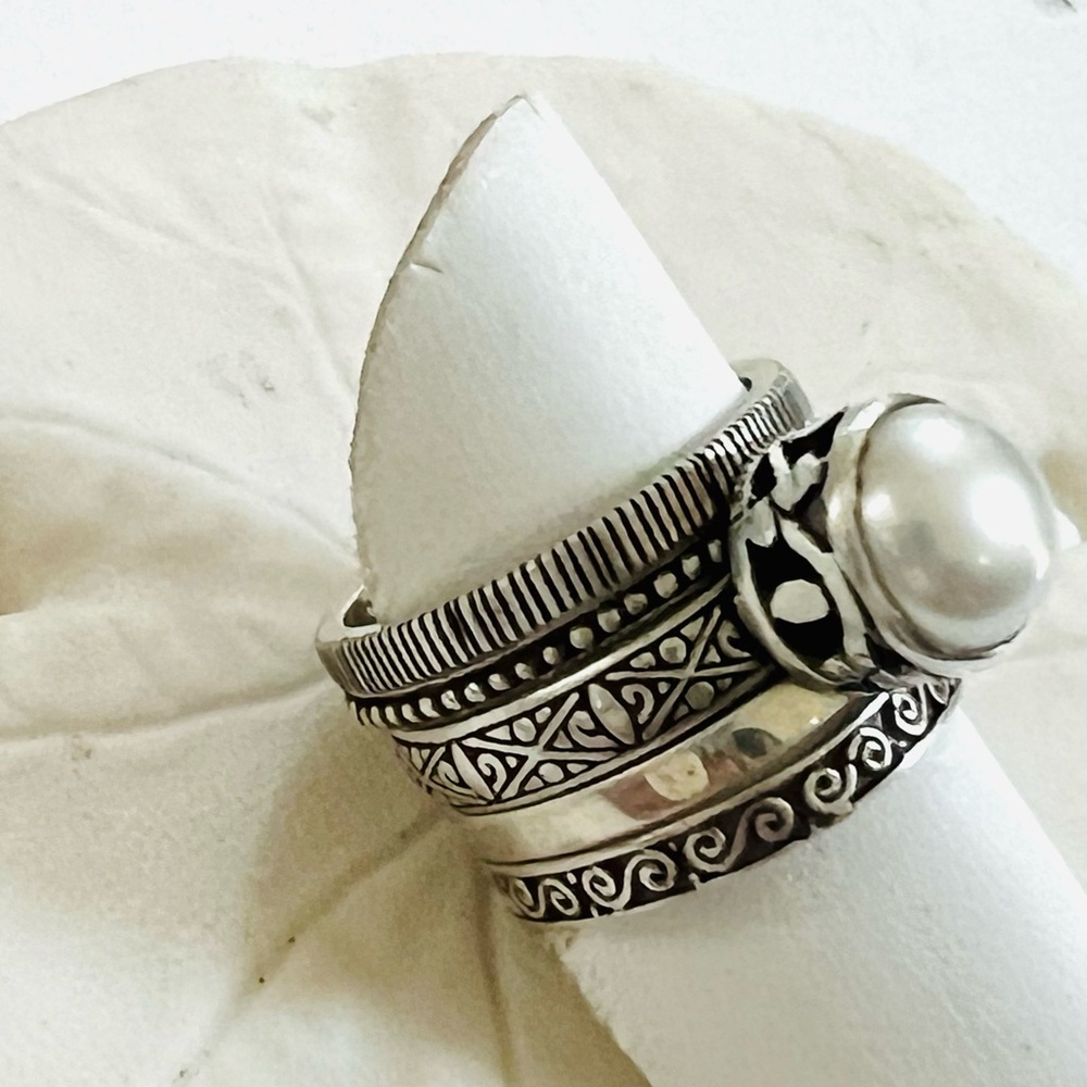 Janice Girardi sterling, silver pearl Stack rings.